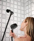 Woman using Matte Black Three Point Five Inch Six Function Detachable Handheld Showerhead With Magnetic Docking System Easy Install