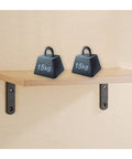 Top Tier Heavy Duty L Shaped Corner Brackets For Shelving Set Of 2 Black Metal Wall Mounts supporting a wooden shelf with weights.