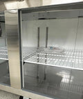 Inside view of Built Tough Commercial Pizza Prep Table Refrigerator, 90 Inch Stainless Steel Workcounter with open shelves.