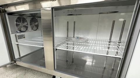 Inside view of Built Tough Commercial Pizza Prep Table Refrigerator, 90 Inch Stainless Steel Workcounter with open shelves.