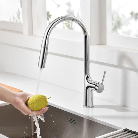 SUMERAIN Kitchen Faucet with Pull Down Sprayer Dual Mode Brushed Gold shown washing a pear in modern kitchen sink.