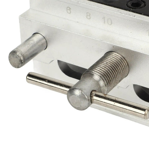 Close-up of Heavy Duty Self Centering Dowel Jig With Quick Swap Sleeves for 1/4 3/8 and 5/16 Bits durable metal components.