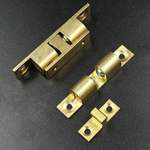 Double Ball Cabinet Door Catch With Adjustable Tension Roller Latch for Small Cabinets, copper body on black background