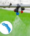 2 In 1 Drip Irrigation Hole Punch And Fitting Insertion Tool For 1/4in PE Tubing No Fuss Easy Install For Emitters And Sprinkler Systems Outdoor Garden DIY Durable Plastic With Nickel Plated Iron Blue in use showcasing sprinkler system in outdoor setting.