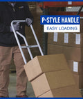 Man using Heavy Duty Steel Hand Truck With 600 Pound Capacity And 10 Inch Flat Free Tires, P Style Handle in warehouse