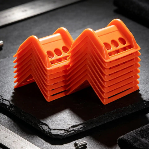 Orange 20 Pack Plastic Flatbed Edge And Corner Protectors stacked for Trucks Heavy Duty Ratchet Strap and Winch Guard use