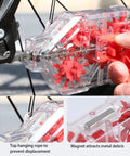Ultimate Bike Chain Cleaning Kit With Deep 360 Degree Clean, clear housing with red nylon brushes in use on bike chain
