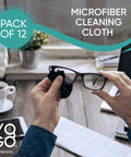 Close-up of hands cleaning eyeglasses with a black microfiber cloth; 12-pack label and brand logo visible.