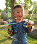 Child playing with 20 Sets Flying Helicopter Toys For Outdoors, Hand Spin Rotating Circle Helicopters in park