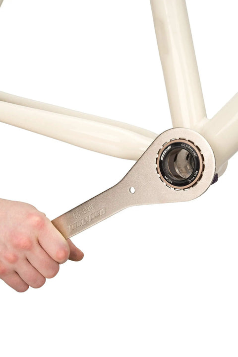 BBT-29 Double-Ended Bottom Bracket Tool for 16-notch cups 39mm and 48.5mm in use on bike frame for maintenance