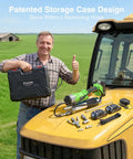 Man holding cordless 12000 PSI electric grease gun kit with dual batteries, 48-inch hose, quick release coupler on tractor