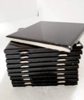 Stack of black ceramic tiles showing edges, Black Ceramic Tile 4 Inch By 4.25 Inch Shower Backsplash For Bathroom And Kitchen Gloss Finish