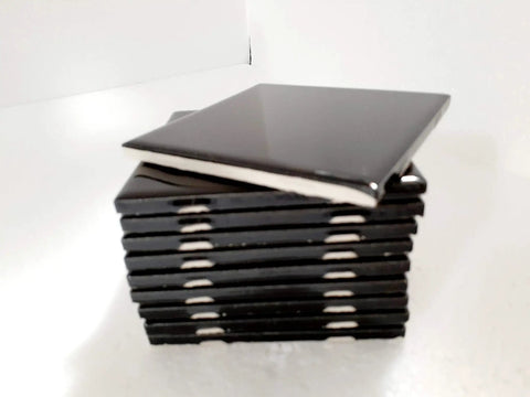 Stack of black ceramic tiles showing edges, Black Ceramic Tile 4 Inch By 4.25 Inch Shower Backsplash For Bathroom And Kitchen Gloss Finish