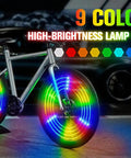 Silver bike with vibrant three-pronged LED wheels, showing the Three Pronged Bicycle Spoke Lights Set for Bike Wheels With 360 Degree Visibility LED Wheel Lights Vibration Sensing Three Color Strip on Each Wheel Two Piece Glow Kit for Night Rides in action.