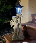 Lit Solar Angel Garden Statue With Roma Pillar For Outdoor Decor And Lawn Or Patio Nineteen Point Seven Inch Left Facing Angel