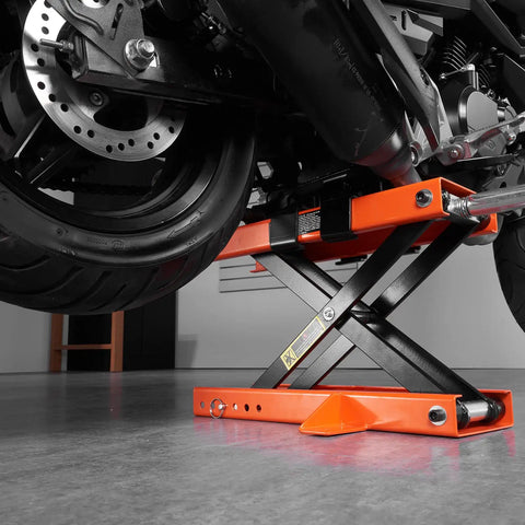 Beefy 1100 Lbs Motorcycle Lift Center Scissor Jack in use lifting rear wheel of motorcycle in garage setting