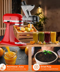 Front view of red KitchenAid stand mixer with Cofun masticating juicer attachment mounted, dual feed chute.