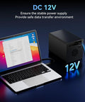 Super Solid Four Bay Hard Drive Enclosure With Built In Cooling Fan For 2.5 And 3.5 Inch Sata Ssd Or Hdd, connected to laptop with 12V power supply.