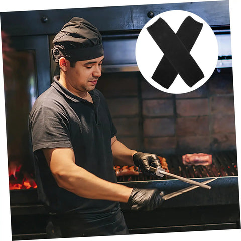 2 Pairs Cut Resistant Arm Sleeves Heavy Slash Proof Arm Guards For Welding Gardening And Mechanic Jobs Built Tough With Breathable PE Mesh So Your Forearms Stay Locked Safe Without The Drama All Day worn by a chef grilling.