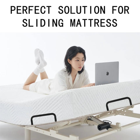 Heavy Duty Mattress Retainer Brackets To Lock Your Bedding Down On Platform Adjustable Or Rv Camper Frames Easy Install Slide Stopper Rails on mattress with a person using a laptop.