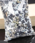 Self Tapping Screw Assortment Kit With Cross Head Flat Head Round Pan Head And Hex Socket Screws, bagged for DIY projects and repairs.
