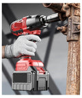 Gangsuqd Brushless Cordless Impact Wrench With High Torque For Car Repair And Home Use, held by a gloved hand, tightening a bolt.