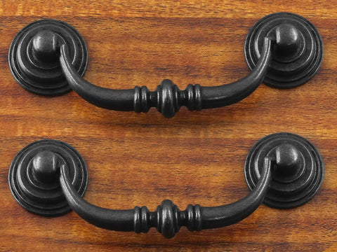 Killer Vintage Black Zinc Alloy Drop Bail Cabinet Pulls Set Of Six With Full Hardware Kit Perfect For Kitchen Cabinetry And Furniture Makeovers Slick Smooth Finish Upgrade on wooden surface.