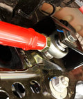 Close-up of Rear Adjustable Toe Rod Kit With Spherical Rod Ends and Red Powder Coat for Chevy Camaro 2016.