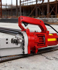 Heavy Duty Hydraulic Electric Rebar Cutter 1700W Pure Copper Motor Portable Steel Bar Cutting Machine close-up on site with steel rods.