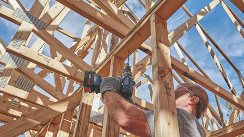 Worker using PROFACTOR 18V Connected Ready Half Inch Hammer Drill and Driver Bare Tool Built to Crush Tough Jobs With Onboard UI