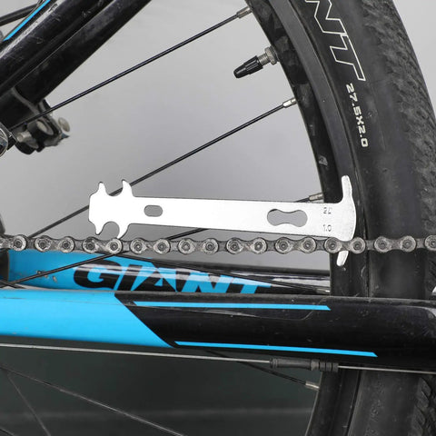 All In One Bicycle Chain Tool Kit With Missing Link Pairs, Wear Gauge checking chain wear on bike wheel
