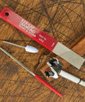 Bring Your Dull Drill Bits Back To Life With This Kickin Three Piece Forstner Bit Sharpening Kit For Carbide Tipped Woodworking Jobs Making Fresh Cuts Has Never Been So Smooth Operator Friendly with sharpening tools laid out on wood.