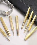 Brass Pin Punch Set 2 Pack Three Sixteenths Inch Nonmarring Drive Punch for Watch Repair Jewelry Craft on table with watch