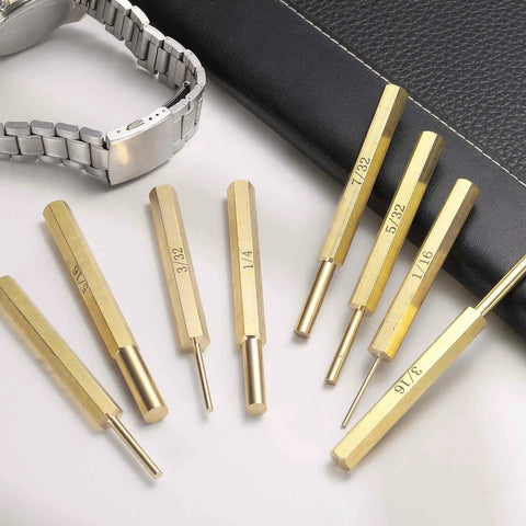 Brass Pin Punch Set 2 Pack Three Sixteenths Inch Nonmarring Drive Punch for Watch Repair Jewelry Craft on table with watch