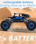 One Eighteen Scale Rock Crawler Remote Control Car With Four Wheel Drive And Two Point Four GHz Off Road Monster Truck Dual Battery Setup Blue Finish speeding through desert terrain