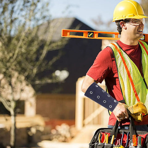 Heavy Duty Cut Proof Arm Sleeves For Yard Work And Backyard Grind Plus Bite Resistant Wrist Guards shielding forearms of a worker.