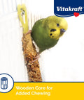 Parakeet enjoying Crunch Sticks Variety Pack Parakeet Treats For Your Feathered Buddy With Orange Apricot Flavor Egg Honey Flavor Sesame Banana Flavor 2.4 Oz Triple Baked For Long Lasting Enrichment hung in cage.