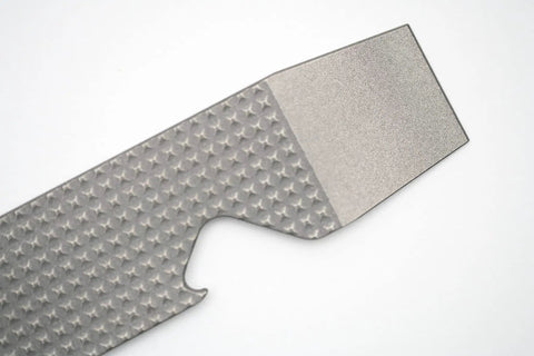 Close-up of Ultra Slim Pry Bar Keychain Tool Pocket Titanium Multitool for Everyday Carry showing textured titanium finish.