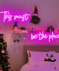 Pink 25x11 Inch Neon Sign LED Neon Lights For Bedroom Wall Decor above a festive bed and Christmas tree