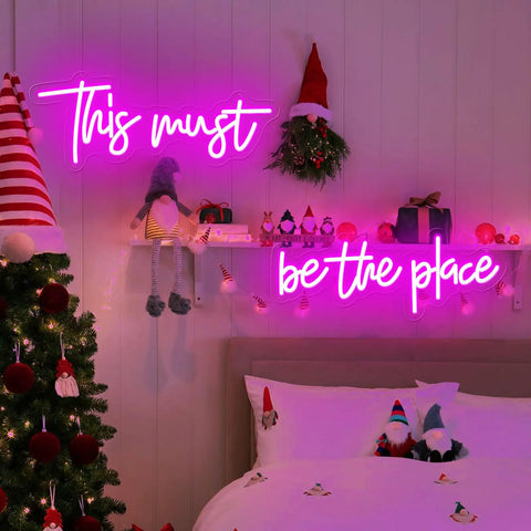 Pink 25x11 Inch Neon Sign LED Neon Lights For Bedroom Wall Decor above a festive bed and Christmas tree