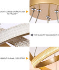 Close-up of Modern LED Chandelier Dimmable Pendant Light With Two Ring Dope Design showing gold finish and glass light cover.