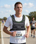 Man running at marathon wearing Lightweight Running Vest With 2L Water Bladder, Easy Breath Hydration Chest Pack For Men And Women