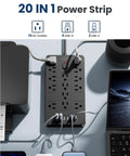 Heavy Duty 6 Ft Extension Cord Surge Protector Power Strip With 14 AC Outlets And 6 USB Ports on a desk setup with devices.