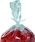 Clear bag sealed with a white plastic twist tie from a twist tie spool for sealing bags, containing red cable connectors.