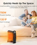 Air Choice 700W oil-filled radiator heater, black, compact indoor heater on living room floor near sofa