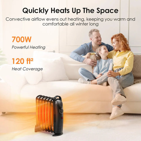Air Choice 700W oil-filled radiator heater, black, compact indoor heater on living room floor near sofa