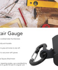 Close-up of Stair Gauges For Framing Square With Holder And Hook on a woodworking table with tools visible.