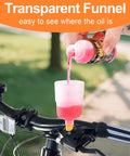 Pouring fluid into the clear funnel of the Road Ready All In One Brake Bleed Kit for Hydraulic Disc Brakes on a bike handlebar.