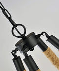 Rock Solid Industrial Chandelier Features Woven Hemp Rope And Sturdy Metal Candle Holders To Set A Chill Farmhouse Vibe, close-up of fixture with black hardware.
