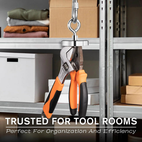 Strong fishing magnet with lifting ring, front view; chrome hardware and orange/black pliers on a workshop shelf